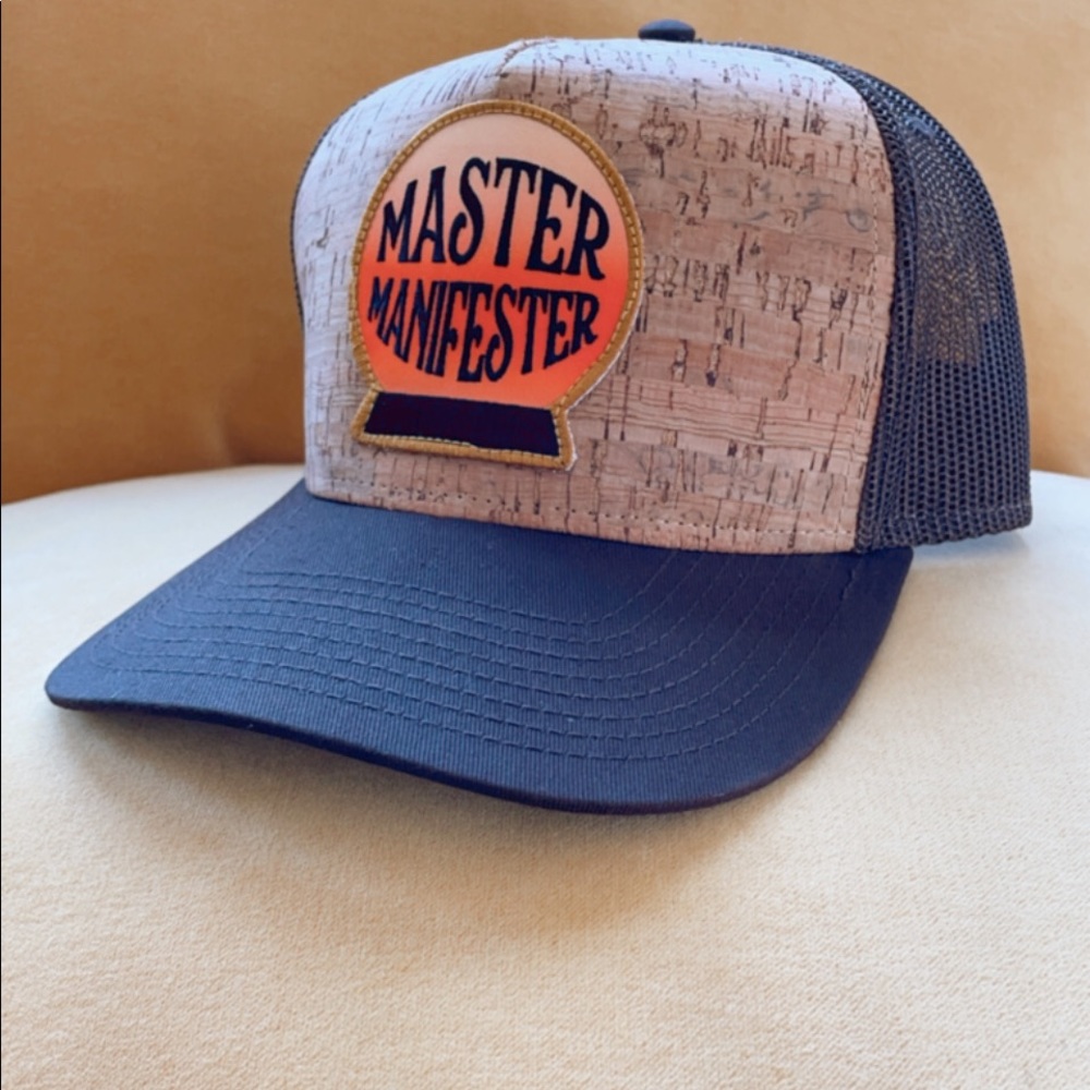 Trucker hat with master manifester logo patch